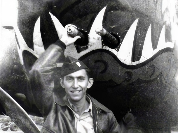 Belvin H. Robin in front of a B-25H's nose art, Biak